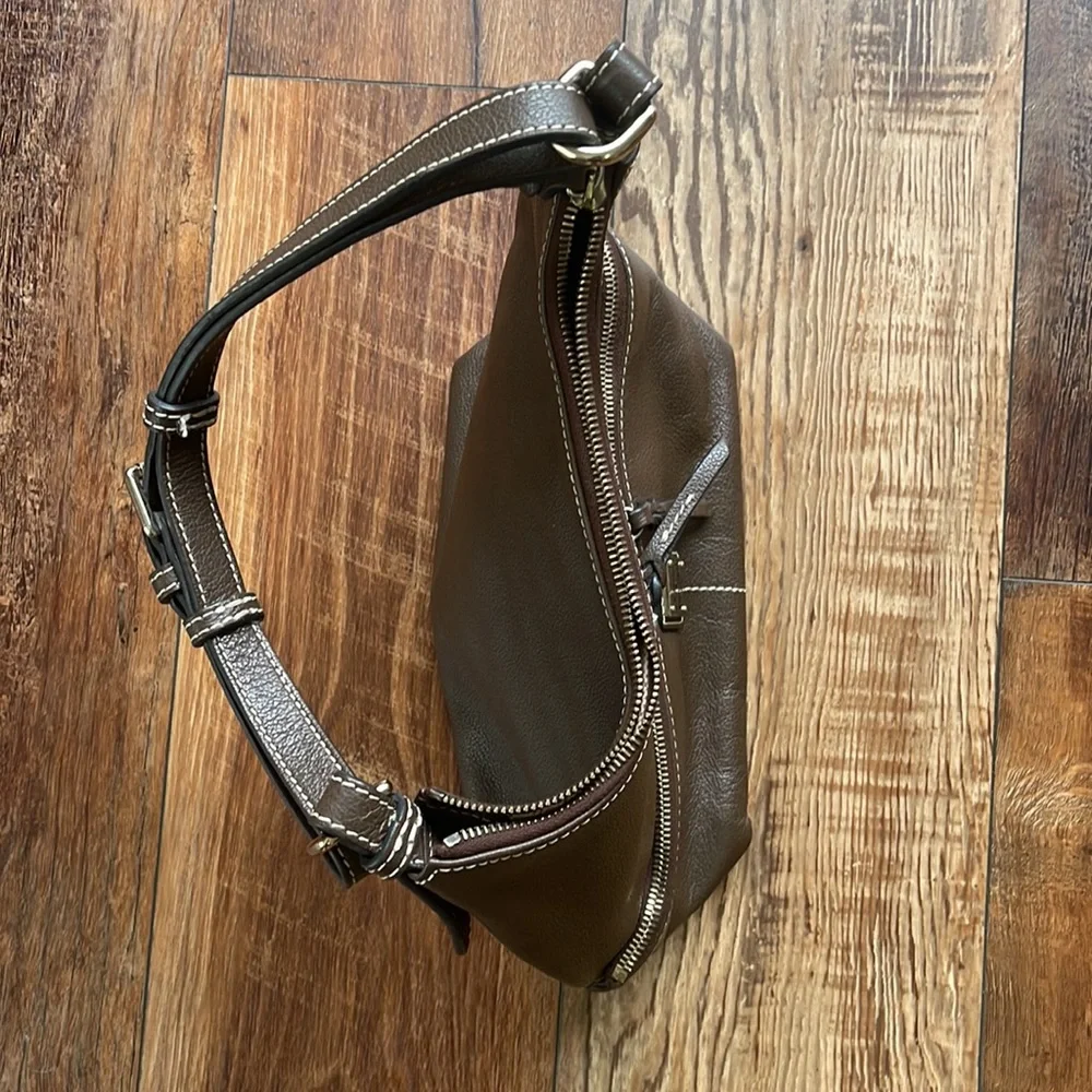 Dooney and Bourke. Brown leather shoulder bag. Has interior stains. - Picture 6 of 14